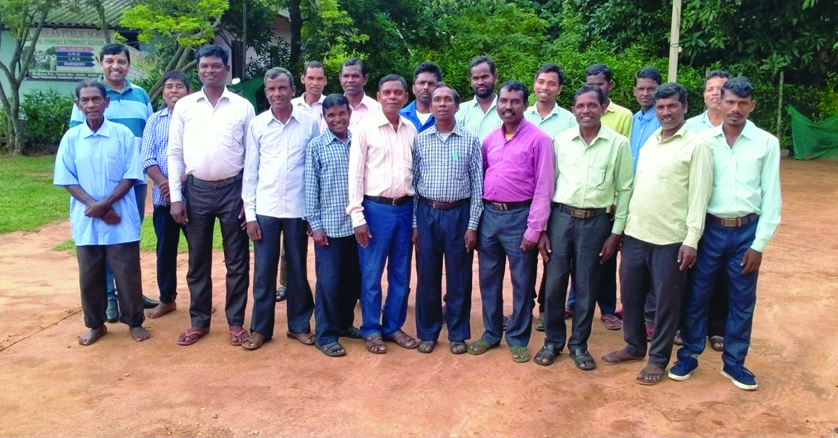 A group photo of village leaders, together to learn about TCD