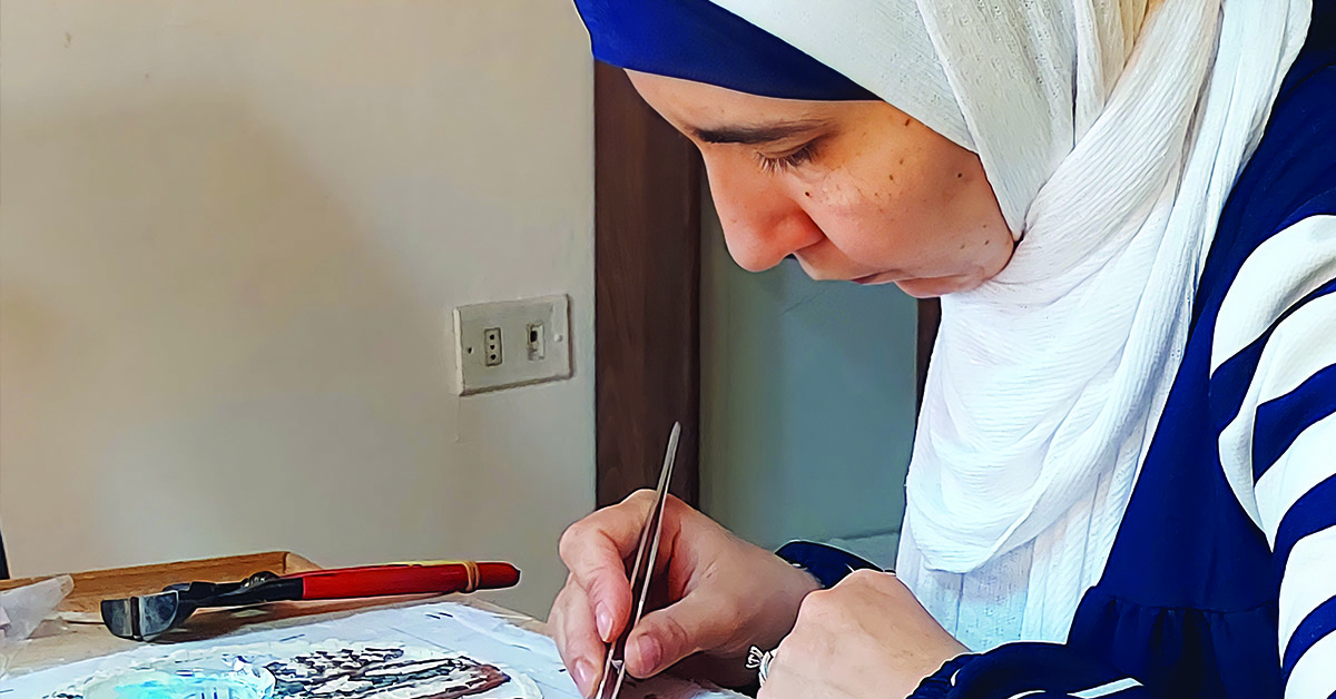One of the students, Hamida, focused on her work