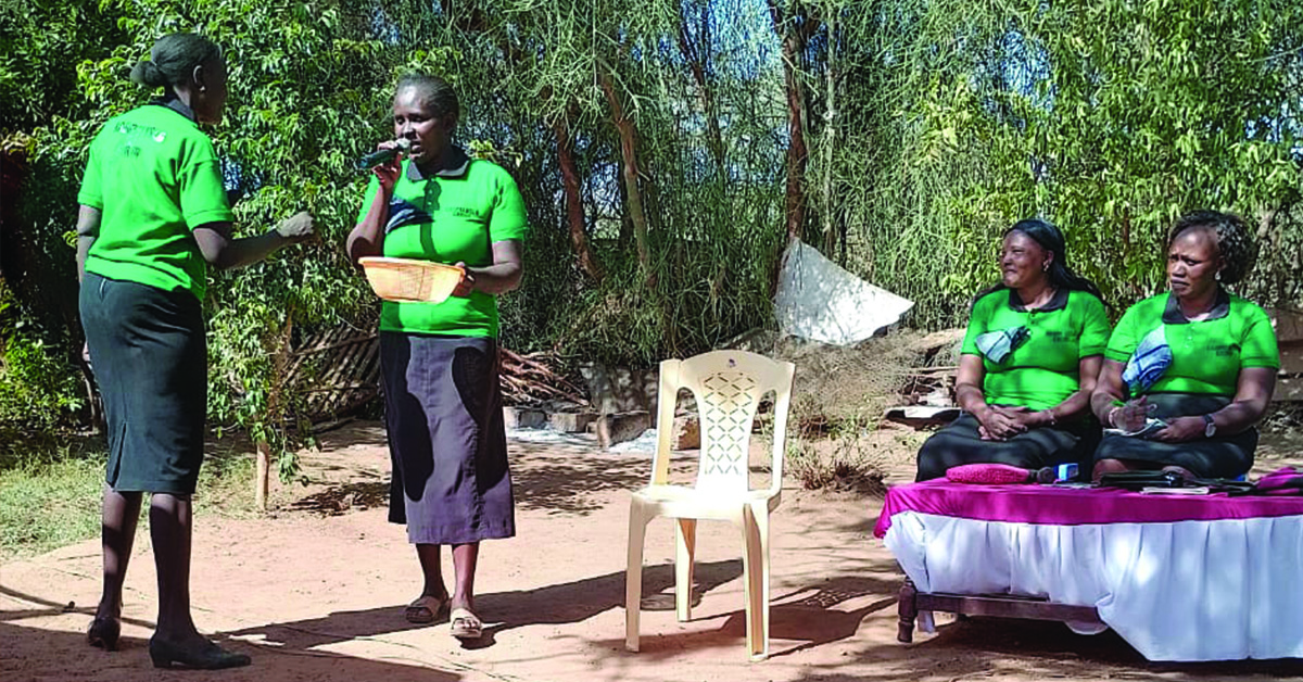 A village woman speaking with a microphone