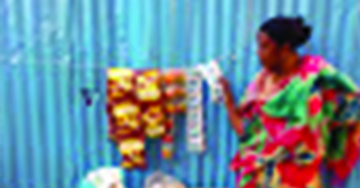 Kenyan villager, Buke, and her small business food stand