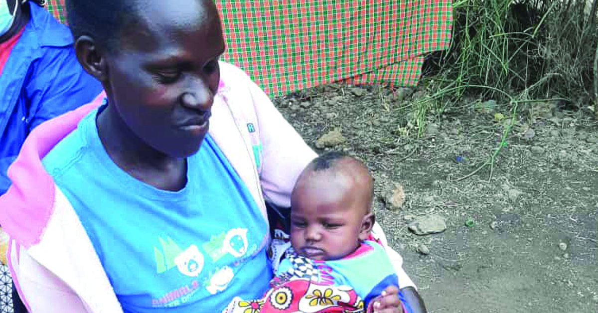 A Kenyan mother holding her newborn baby