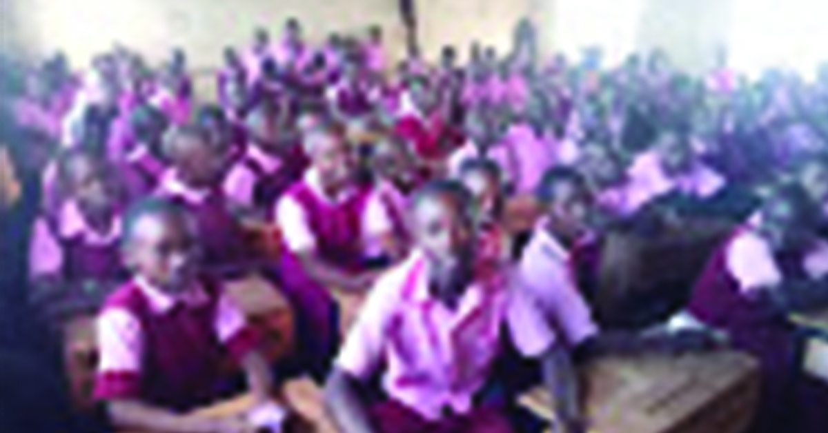 KE-011 Kiwanjani Kenya 2022 10 Q4 – PHOTO 1 of 3 – This is Ntulili pupil in their guidance and counselling classes A classroom filled with students in red uniforms.