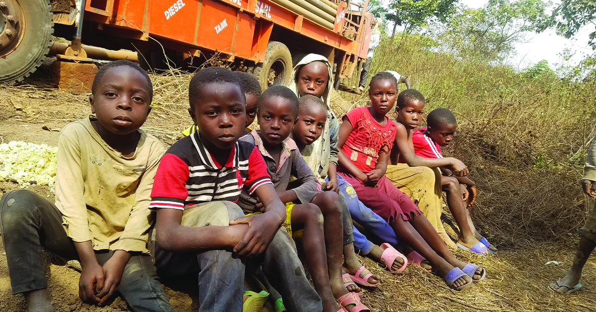 A row of Cameroon children sitting together.