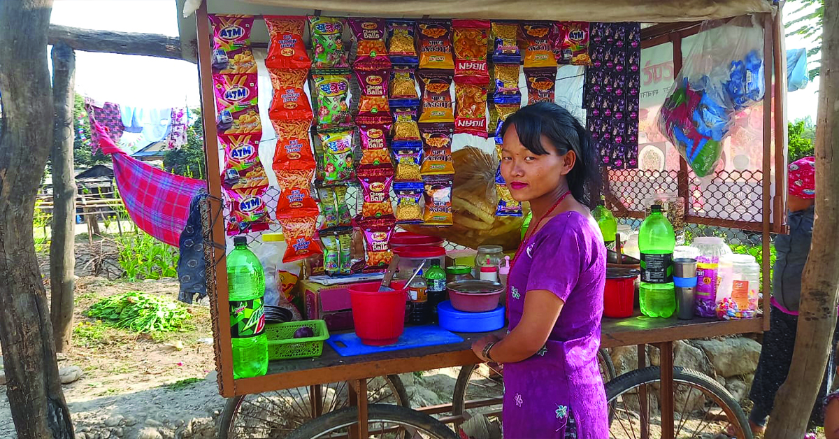 A Nepal woman and her food stand.